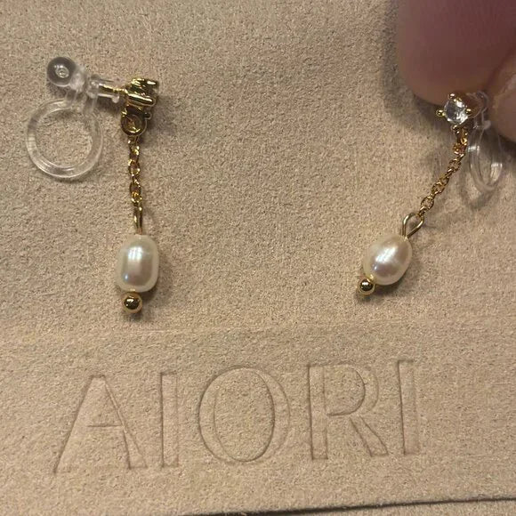 3 PIECES OF AIORI JEWELRY: 2 CLIP ON EARRINGS - 1 BANGLE