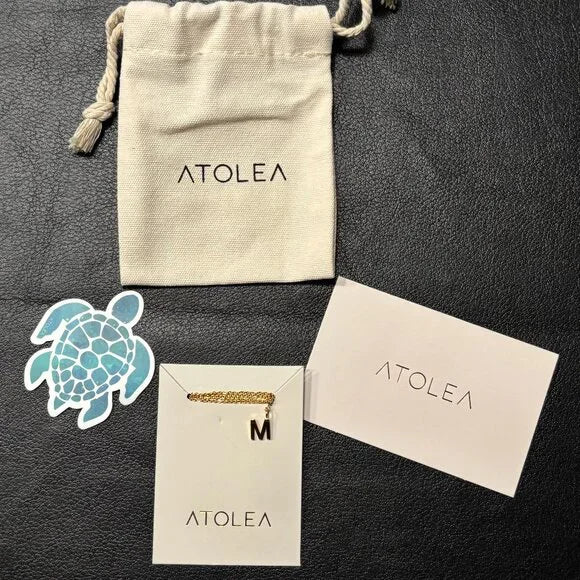 ATOLEA INITIAL NECKLACE "M" STAINLESS STEEL PLATED WITH 18K GOLD. 17.5 - 19.5 IN
