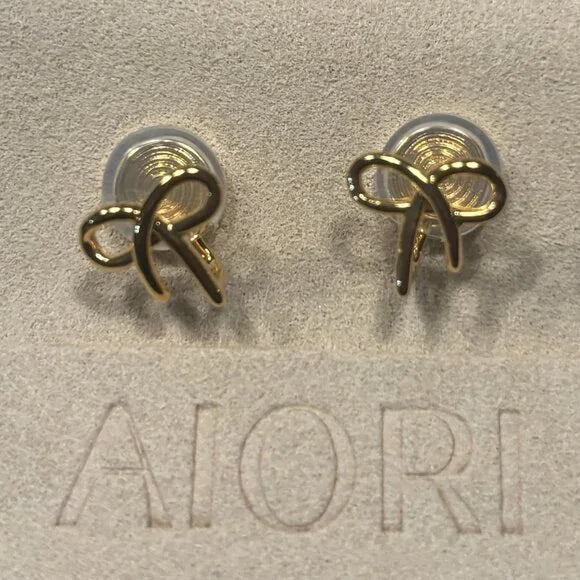 3 PIECES OF AIORI JEWELRY: 2 CLIP ON EARRINGS - 1 BANGLE